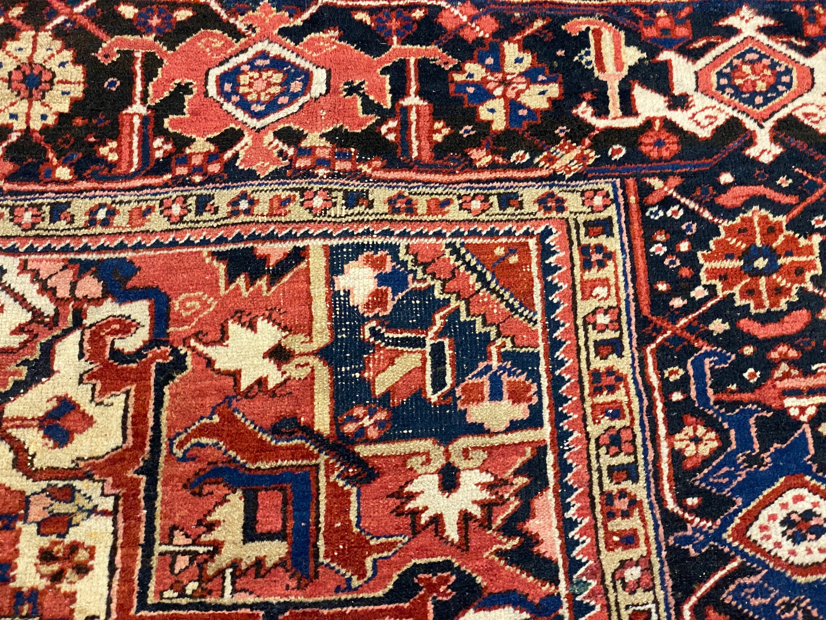 An Heriz red ground carpet, 364 x 265cm